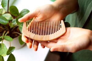 hands holding a comb