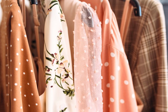 Capsule clothes in beige and pink colors closeup