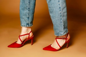 light jeans and pointed red heels