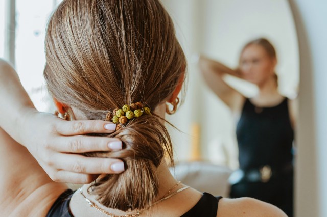 a woman with her hair in a bun