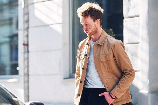 Elegant young man in formal classy clothes outdoors in the city.