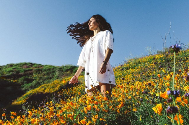 woman standing of flower field