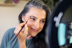 woman applying eyeshadow