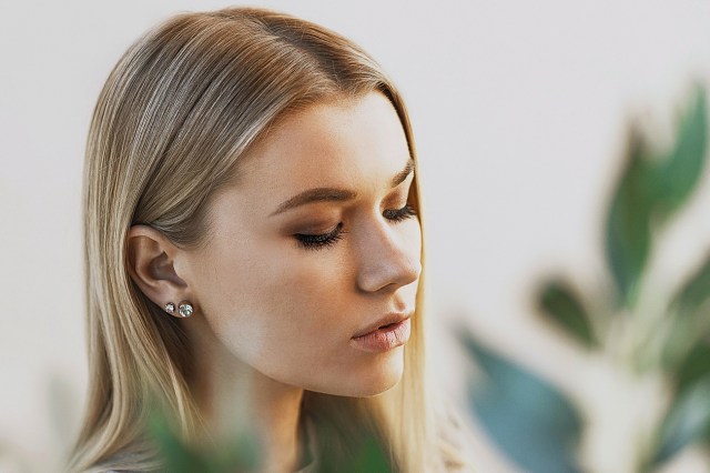 woman with blonde hair looking down