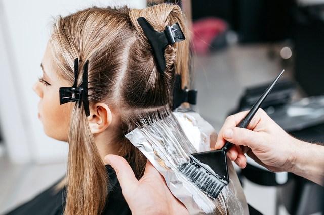 Woman getting her hair colored at a salon