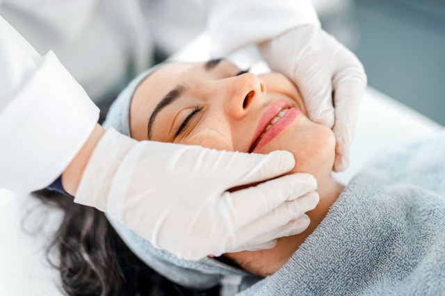 Woman getting facial/dermatology procedure