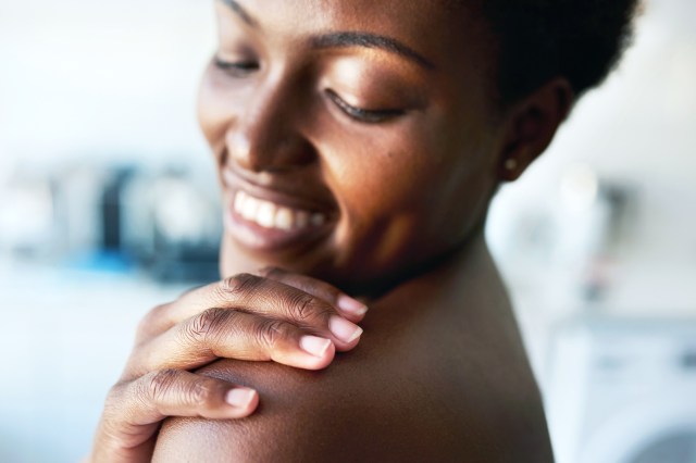 Cropped shot of a woman toughing her soft skin