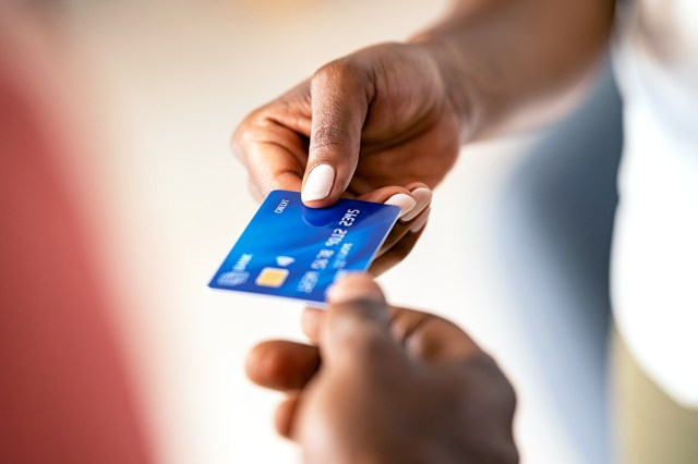 Black woman paying with credit card