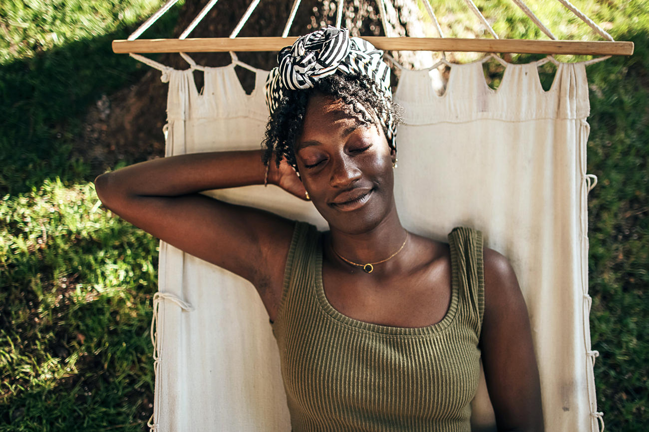 Woman relaxing in a hammock