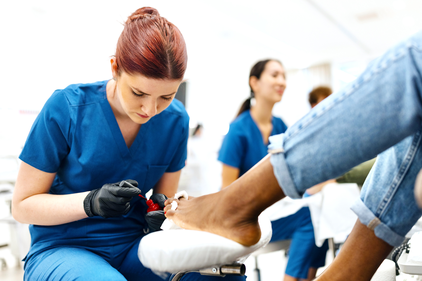 Woman doing her pedicure in a beauty salon