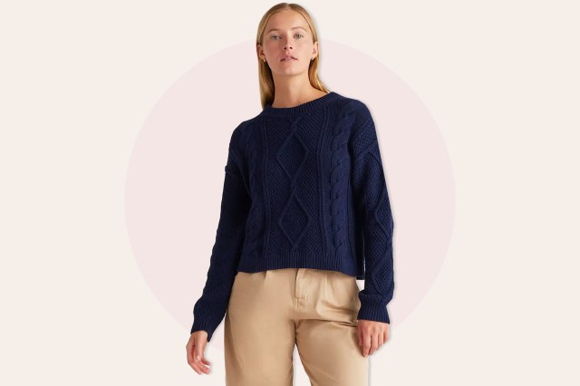 Woman wearing blue sweater and khaki pants