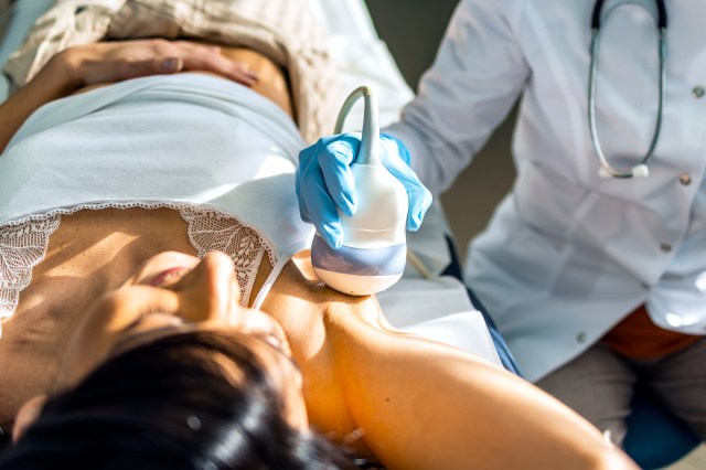 Nurse doing breast examination