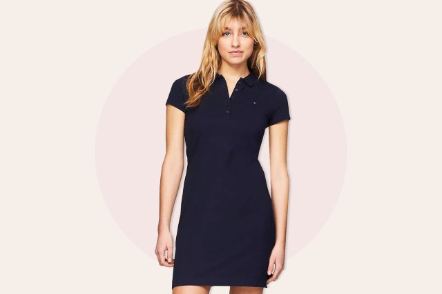 Woman wearing dark blue collared, short sleeve dress