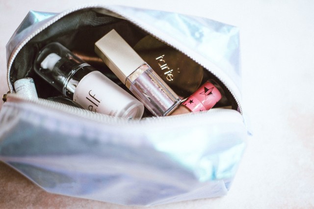 Open make up bag with cosmetics