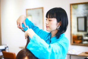 Hairstylist cutting someone's hair