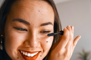 Close up of woman applying mascara