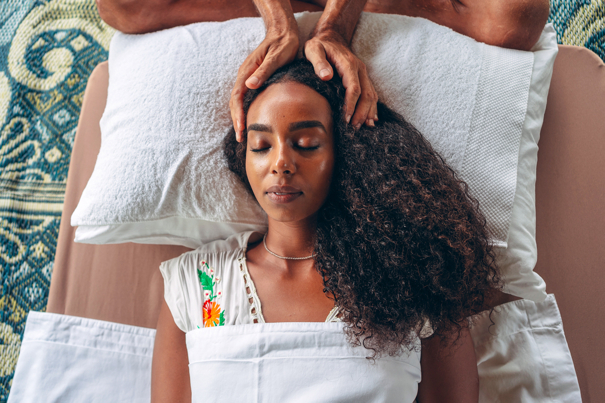 Woman having reiki treatment