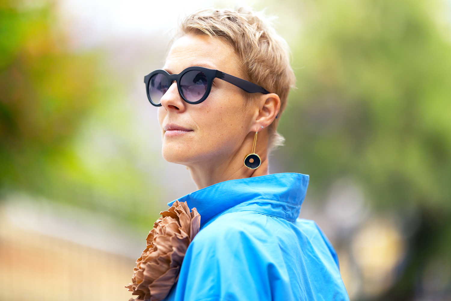 Stylish woman wearing sunglasses