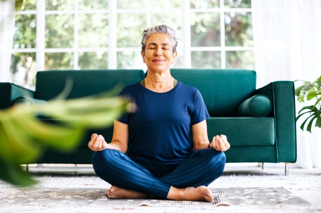 Woman meditating at home