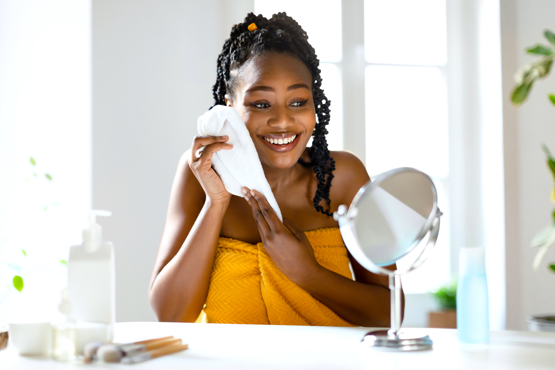 Woman using washcloth on her face