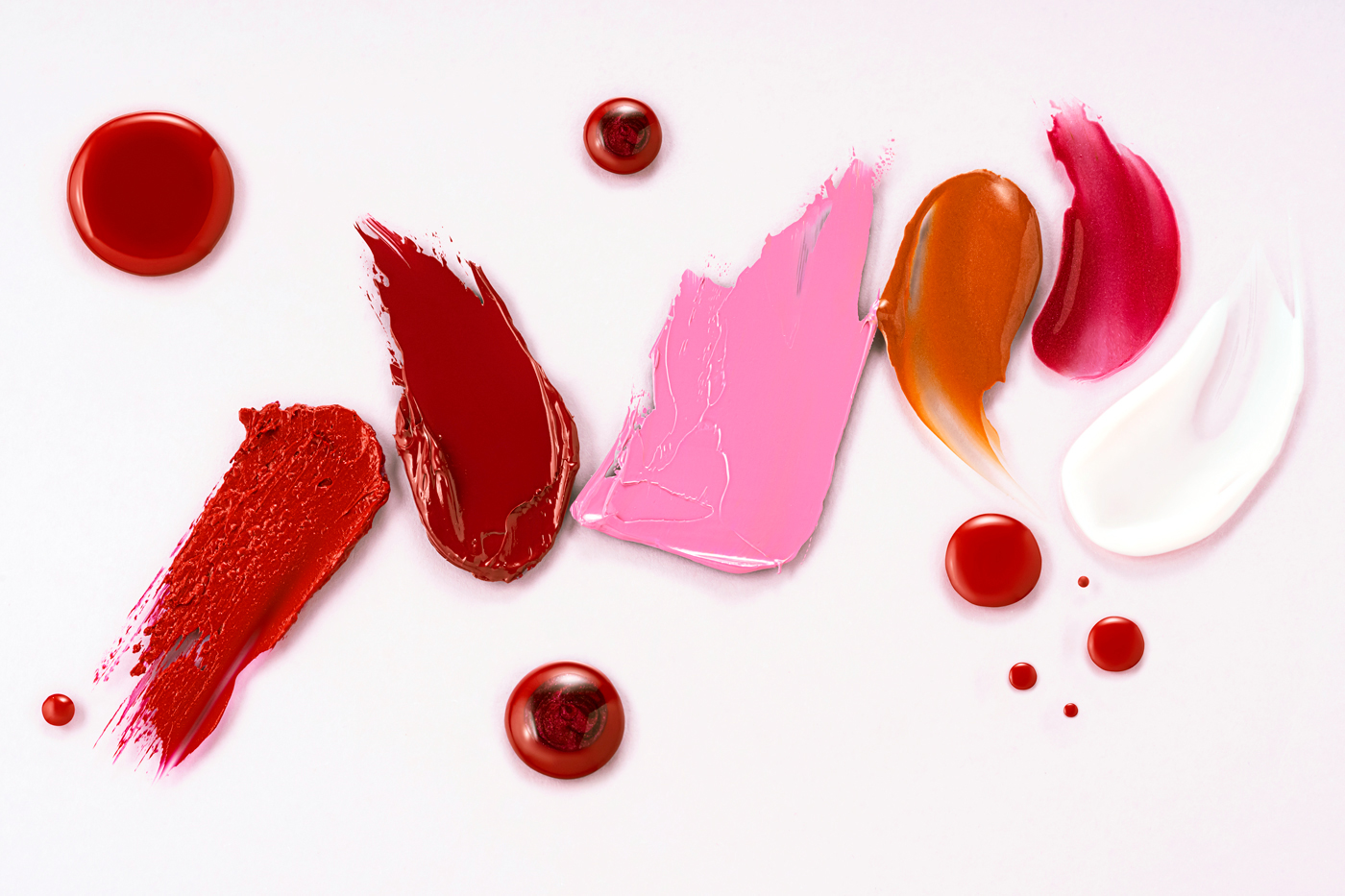 Smears of different colored cosmetic products