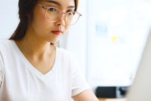 Woman wearing blue light glasses