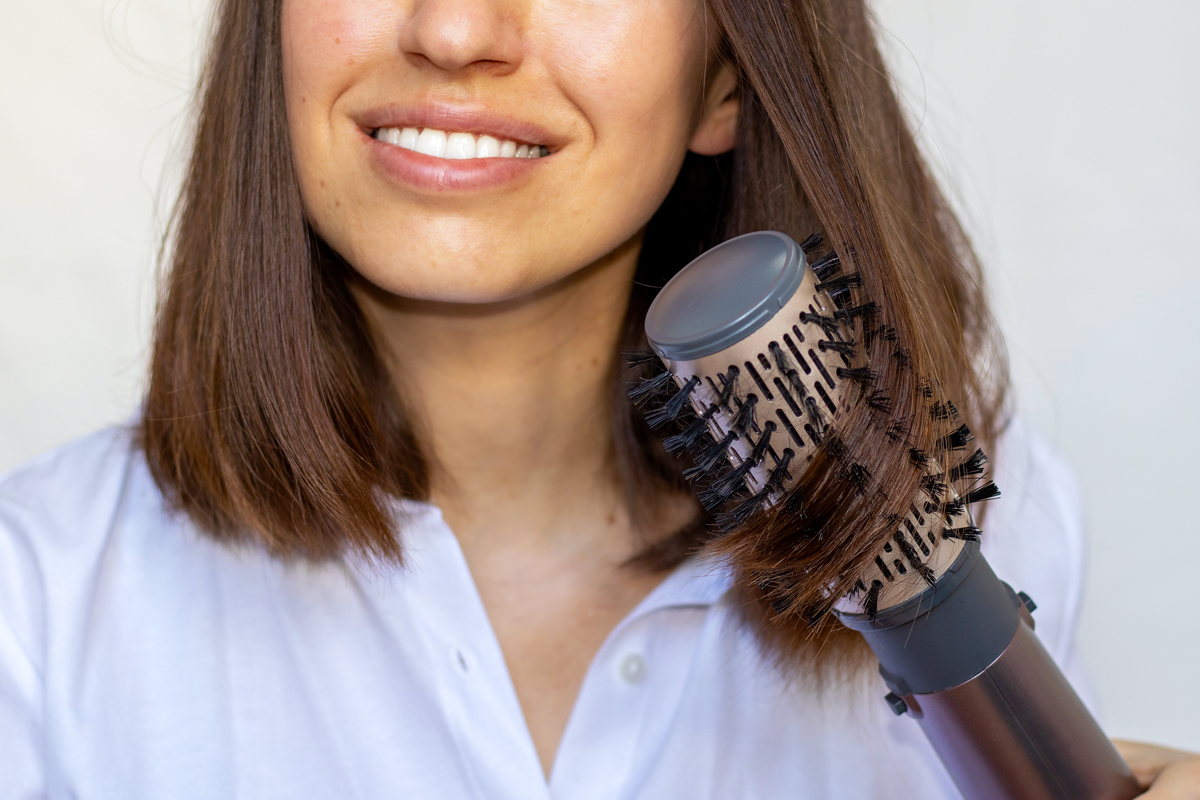 Woman using thermal brush