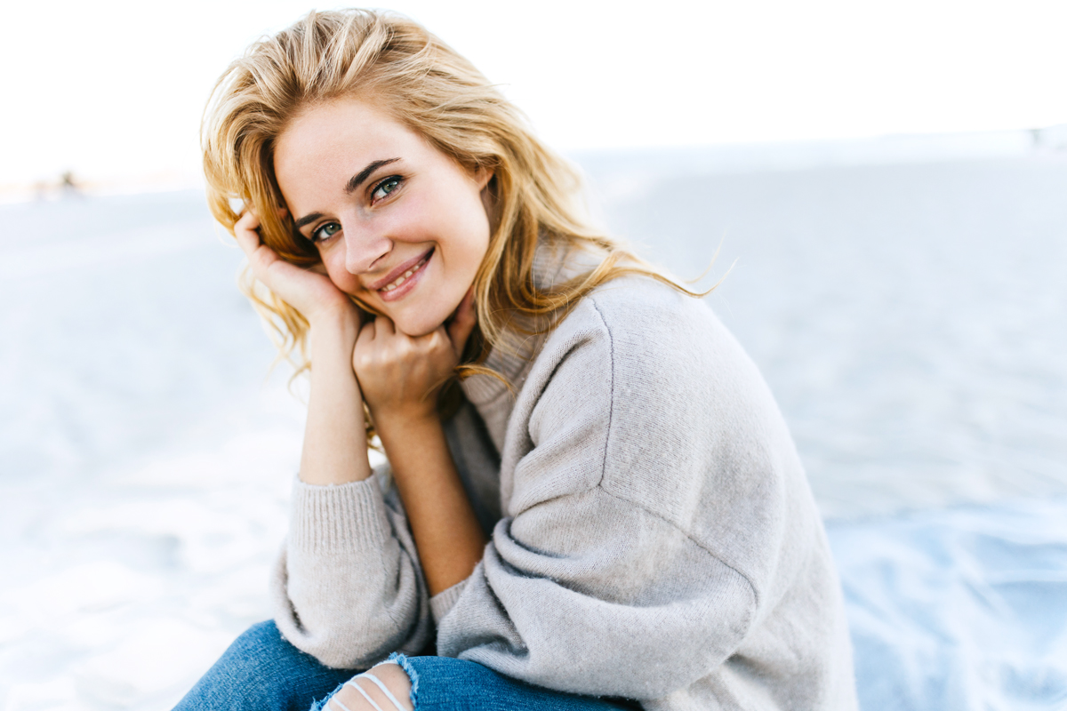 woman wearing gray sweater